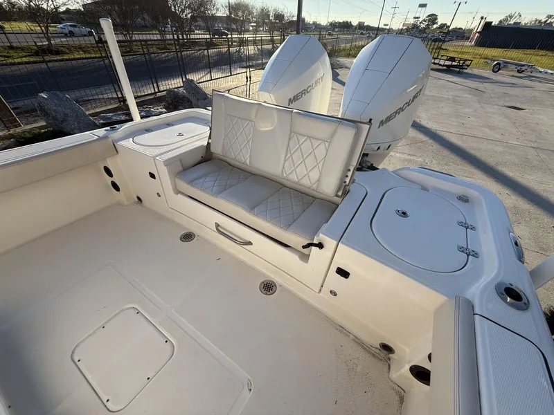 Slide: The Image of 2022 Blue Wave 2800 Makaira boat with dual Mercury engines and cushioned seating. - 14