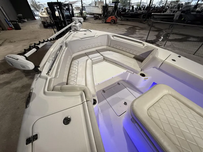 Slide: The Image of 2022 Blue Wave 2800 Makaira boat interior with cushioned seating and modern design. - 20
