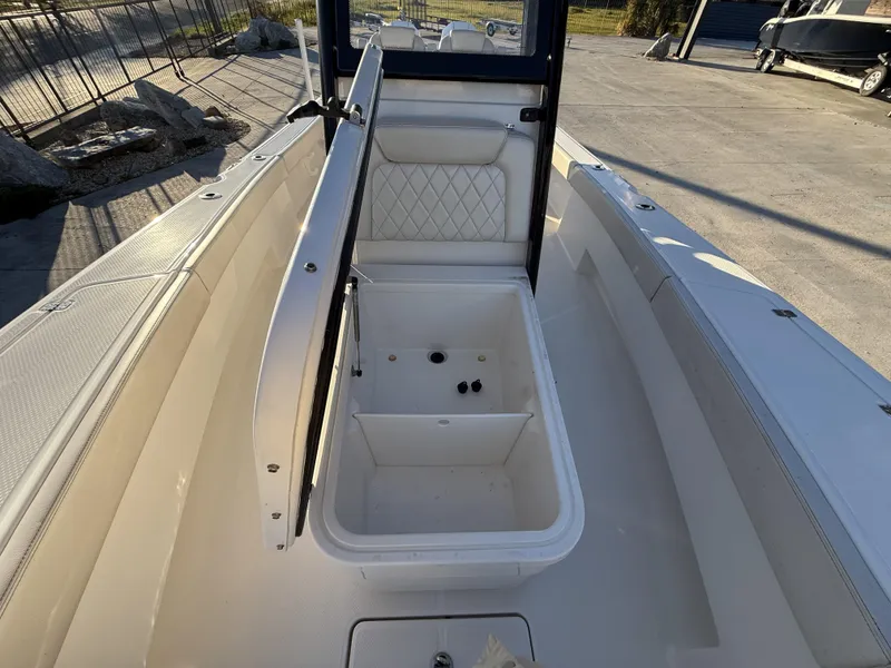 Slide: The Image of 2022 Blue Wave 2800 Makaira boat interior with open storage compartment. - 22