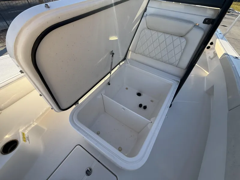 Slide: The Image of Open storage compartment on 2022 Blue Wave 2800 Makaira boat. - 23