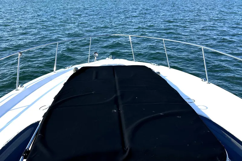 Slide: The Image of 2010 Sea Ray 370 Sundancer bow view on open water. - 19