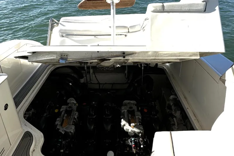 Slide: The Image of Engine compartment of 2010 Sea Ray 370 Sundancer boat, open hatch, docked on water. - 21