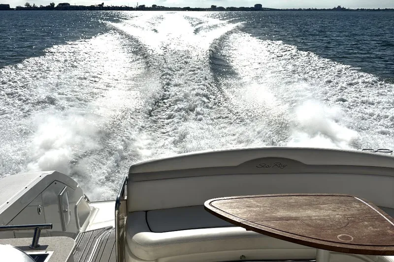 Slide: The Image of Sea Ray 370 Sundancer 2010 cruising on open water, view from the deck. - 26