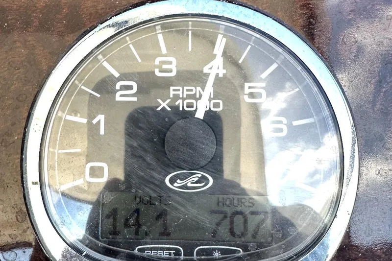 Slide: The Image of Tachometer of 2010 Sea Ray 370 Sundancer showing 141 volts and 707 hours. - 27