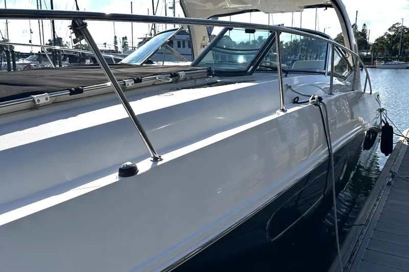 Slide: The Image of 2010 Sea Ray 370 Sundancer yacht docked at marina, side view. - 28