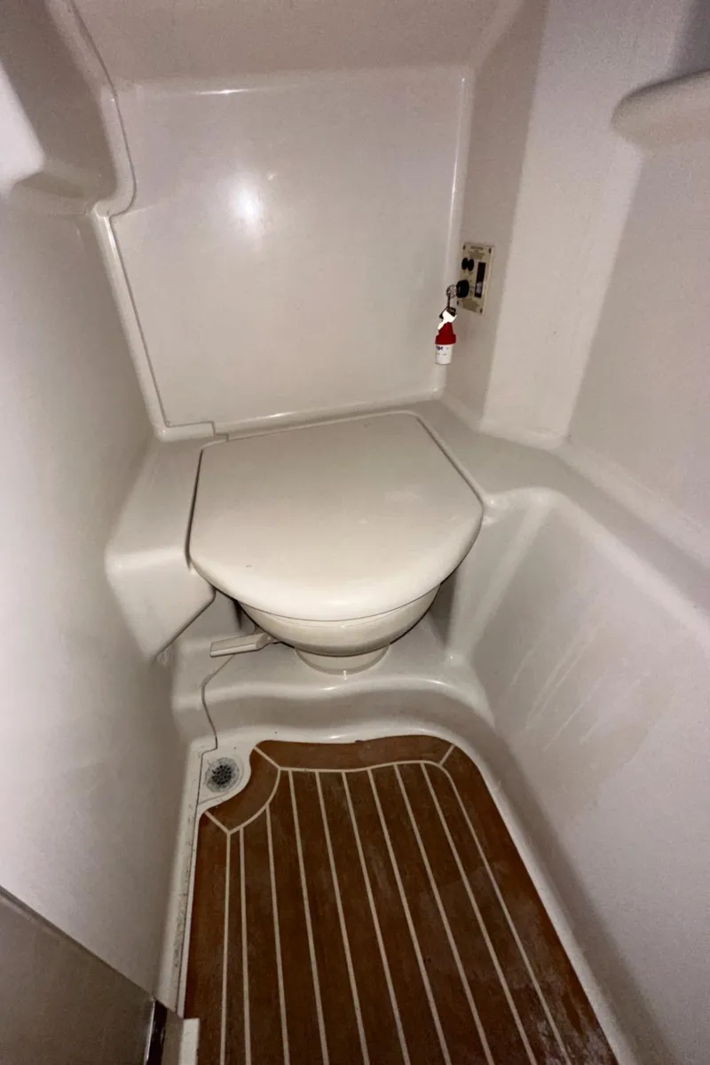 Slide: The Image of Compact bathroom in 2010 Sea Ray 370 Sundancer yacht with wooden flooring. - 33