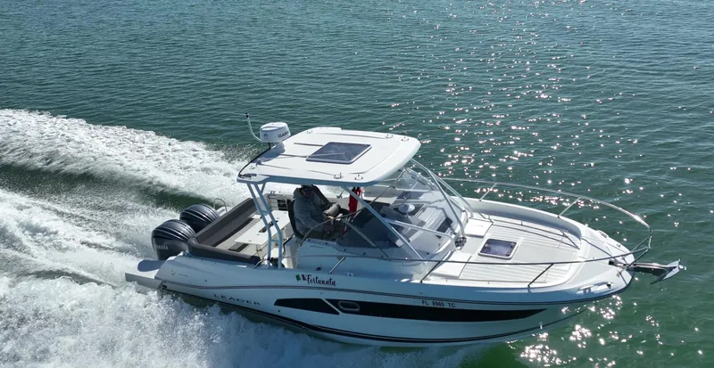 Slide: The Image of 2021 Jeanneau Leader 9.0 WA cruising on open water. - 1