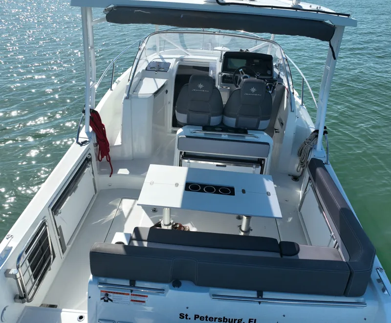 Slide: The Image of 2021 Jeanneau Leader 9.0 WA boat interior with seating and table, St. Petersburg, FL. - 14
