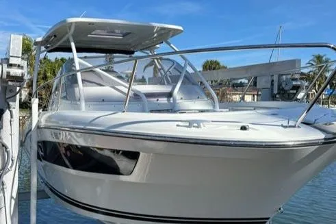Slide: The Image of 2021 Jeanneau Leader 9.0 WA boat docked, featuring sleek design and modern amenities. - 19