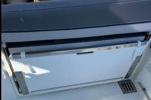 Slide: The Image of 2021 Jeanneau Leader 9.0 WA boat interior detail, featuring a sleek storage compartment. - 25