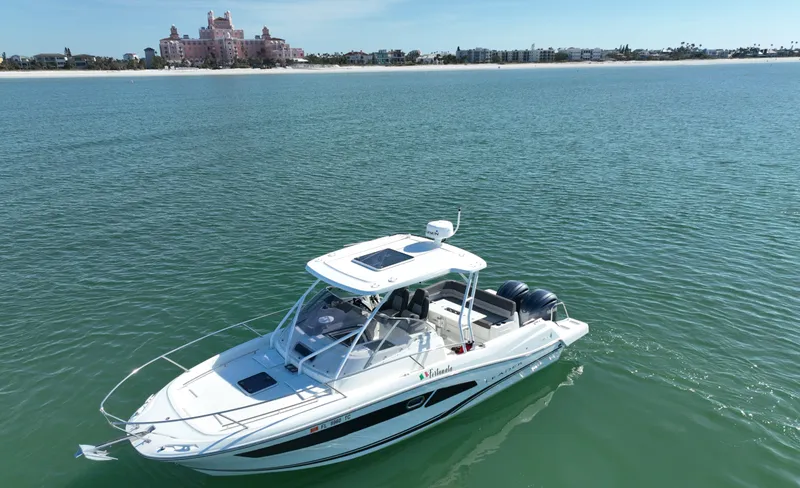 Slide: The Image of 2021 Jeanneau Leader 9.0 WA boat on calm water near a distant shoreline. - 8