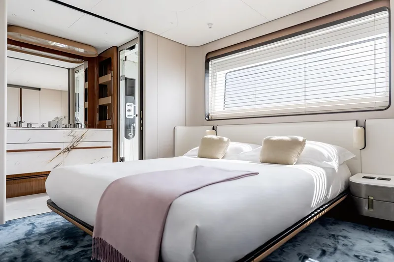 Slide: The Image of Luxurious bedroom in 2024 Azimut Grande 36M yacht with modern decor and large window. - 32