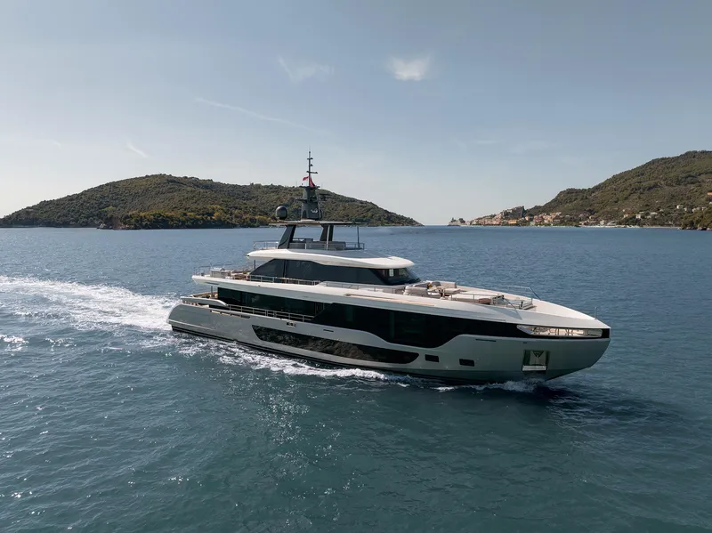 Slide: The Image of 2024 Azimut Grande 36M yacht cruising on open water, surrounded by scenic islands. - 39