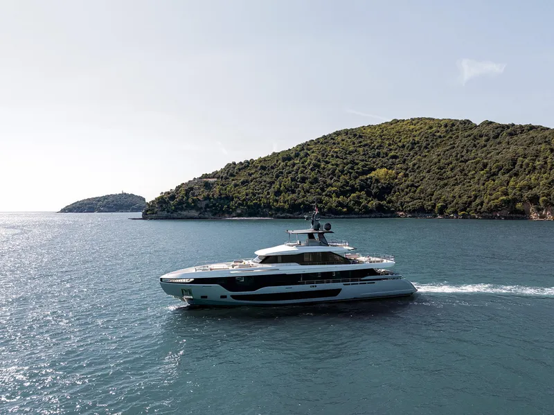 Slide: The Image of 2024 Azimut Grande 36M yacht cruising near lush green islands. - 41