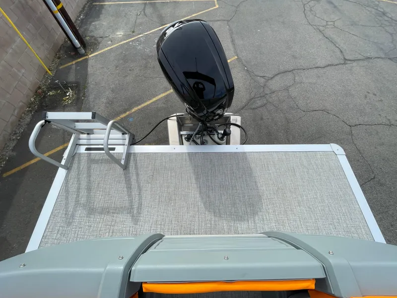 Slide: The Image of 2025 Avalon 21 AURA boat with outboard motor, viewed from above. - 5