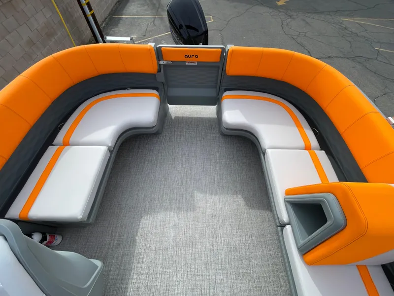 Slide: The Image of 2025 Avalon 21 AURA boat interior with orange and gray seating, modern design. - 6