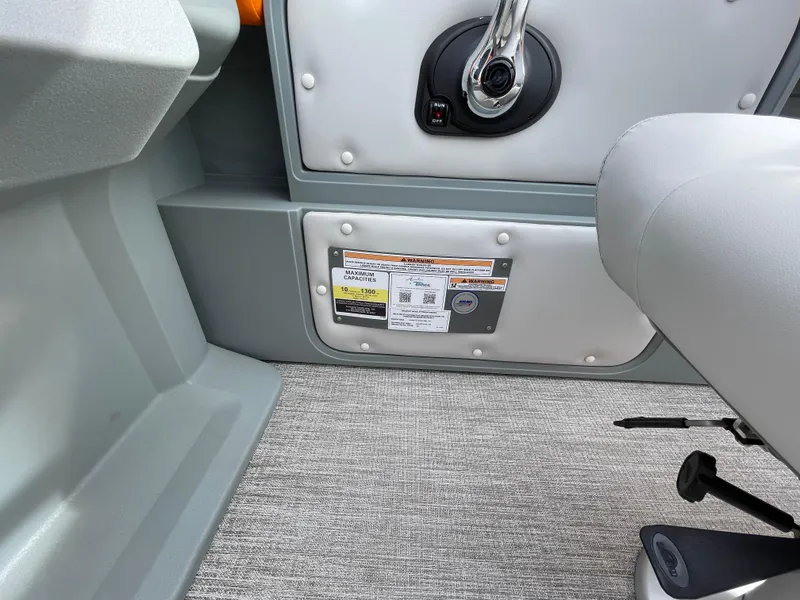 Slide: The Image of Interior view of 2025 Avalon 21 AURA boat, featuring control panel and seating. - 8