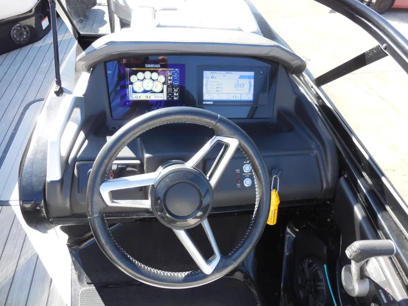 Slide: The Image of Steering wheel and dashboard of 2019 SunCatcher Amara boat with digital displays. - 10