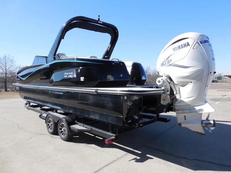 Slide: The Image of 2019 SunCatcher Amara boat with Yamaha engine on trailer, parked outdoors. - 4