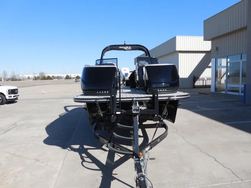 Slide: The Image of 2019 SunCatcher Amara boat on trailer in parking lot, rear view. - 6