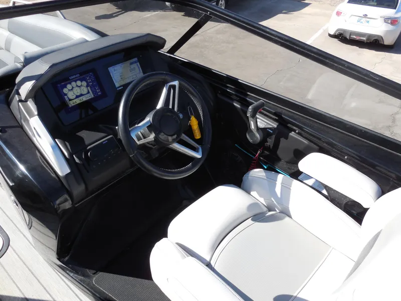 Slide: The Image of 2019 SunCatcher Amara boat interior with steering wheel and dashboard controls. - 9