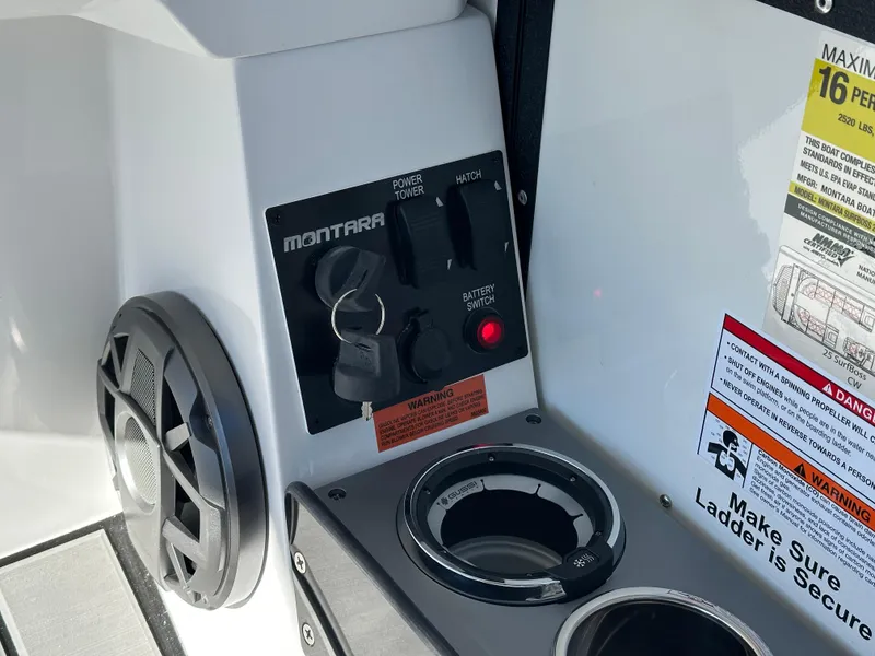 Slide: The Image of Control panel of 2025 Montara Surf Boss 2.0 25 with speaker and safety warnings. - 13