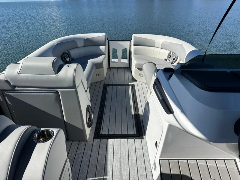 Slide: The Image of 2025 Montara Surf Boss 2.0 25 interior with luxurious seating on calm water. - 14