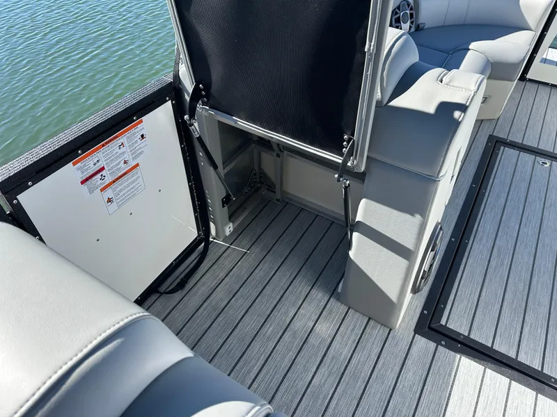 Slide: The Image of 2025 Montara Surf Boss 2.0 25 interior with gray seating and striped flooring. - 15