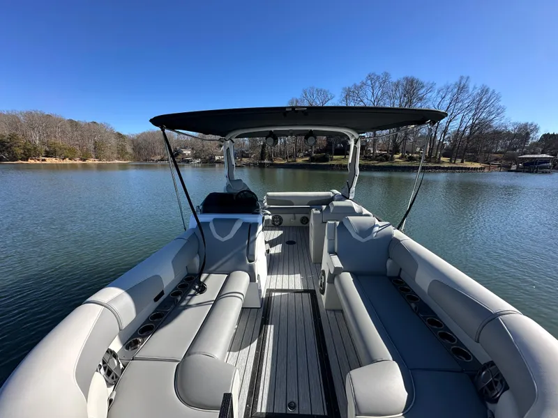 Slide: The Image of 2025 Montara Surf Boss 2.0 25 boat interior on a serene lake. - 18