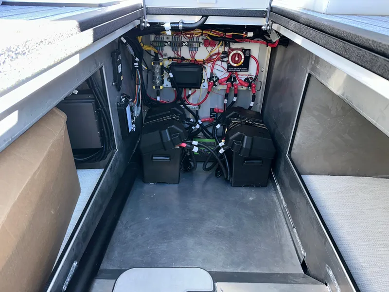 Slide: The Image of Interior view of 2025 Montara Surf Boss 2.0 25 boat's engine compartment. - 22