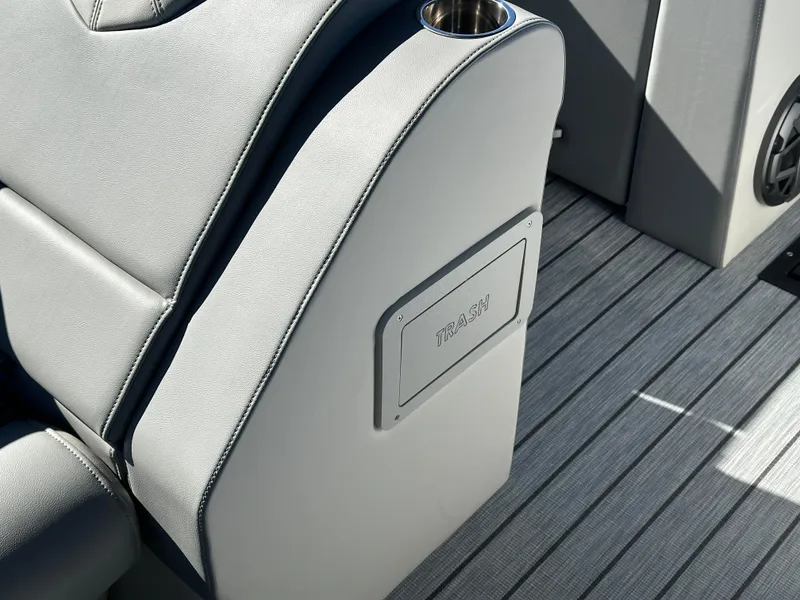 Slide: The Image of 2025 Montara Surf Boss 2.0 25 interior with gray seating and integrated cup holder. - 26