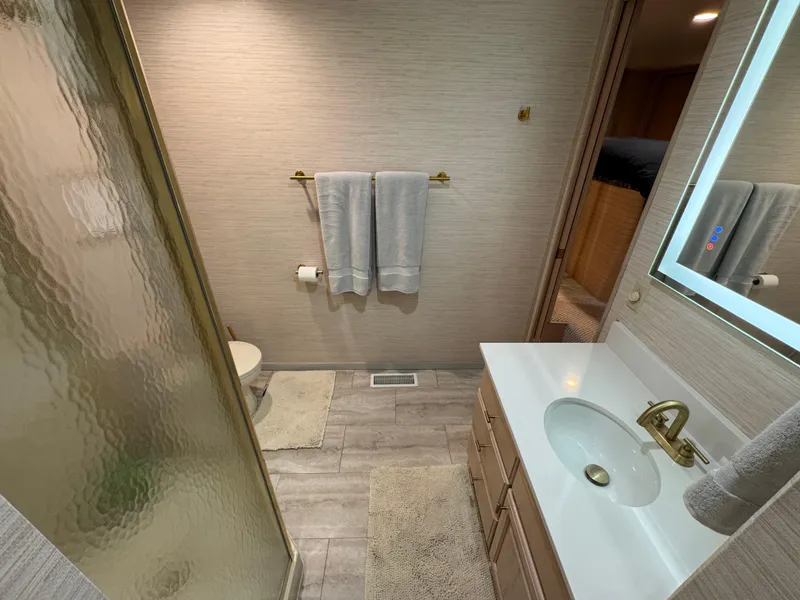 Slide: The Image of Bathroom interior of 1997 Sumerset 85x18 houseboat with modern fixtures and neutral decor. - 20