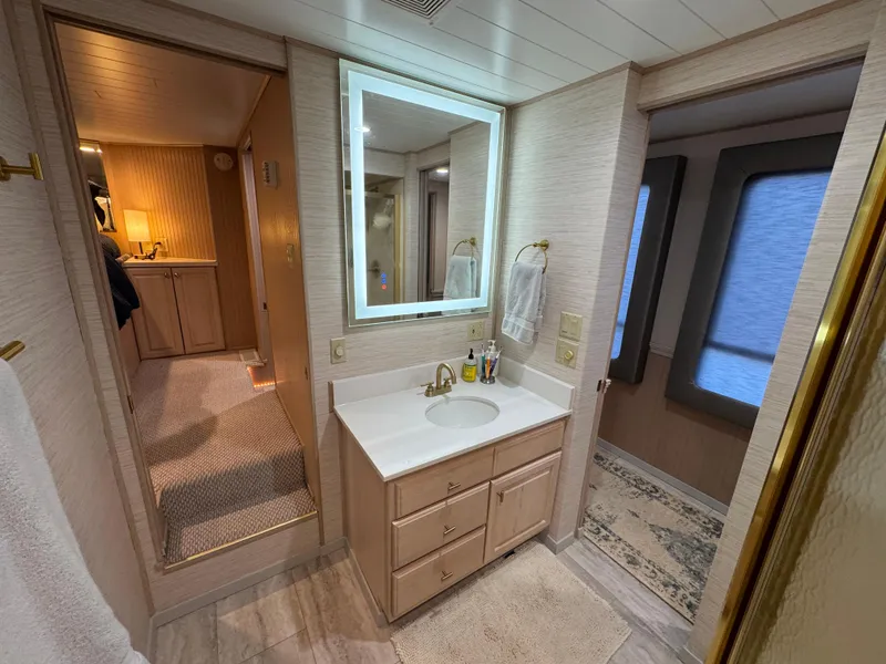 Slide: The Image of Bathroom interior of 1997 Sumerset 85x18 houseboat with modern vanity and mirror. - 21