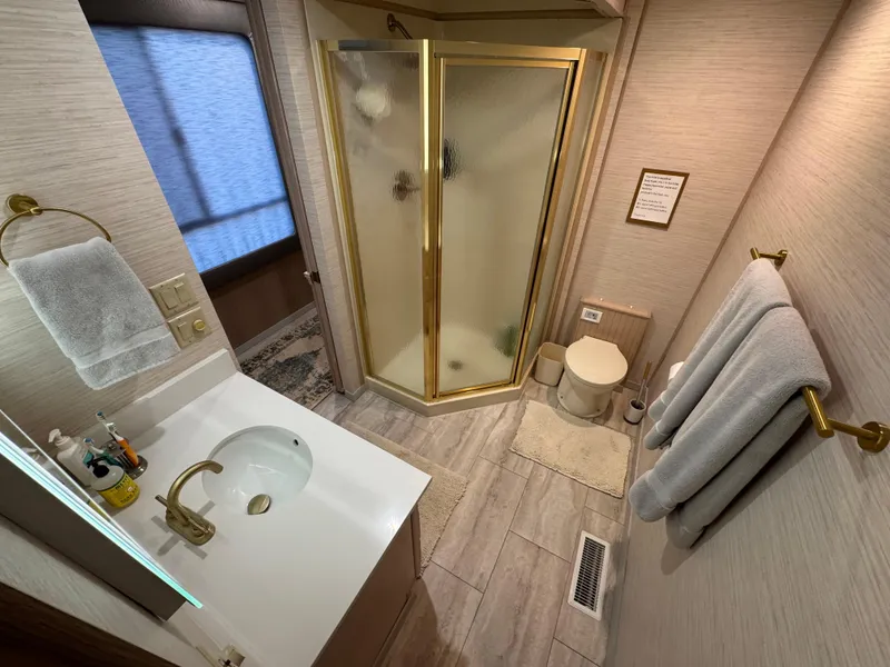 Slide: The Image of Bathroom interior of a 1997 Sumerset 85x18 houseboat with shower and vanity. - 22