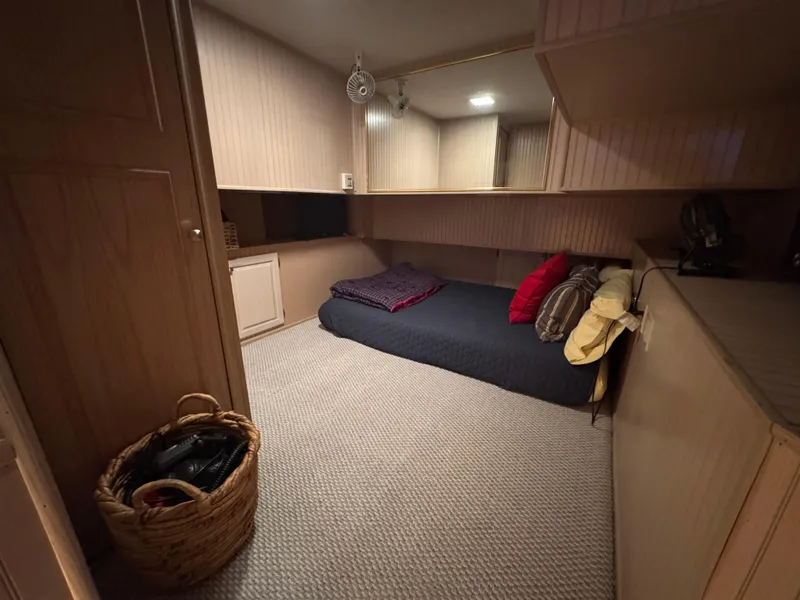 Slide: The Image of Cozy bedroom in 1997 Sumerset 85x18 houseboat with carpet and cushions. - 24