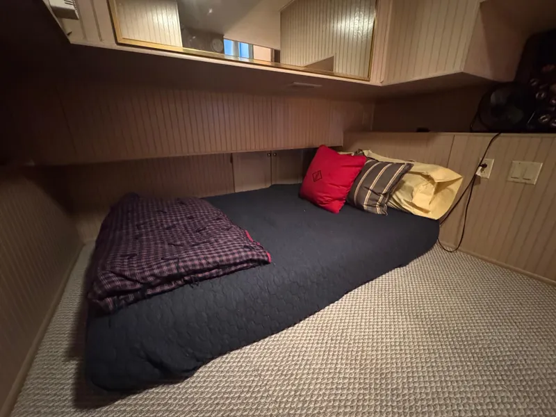 Slide: The Image of Cozy bedroom in 1997 Sumerset 85x18 houseboat with pillows and blanket. - 25