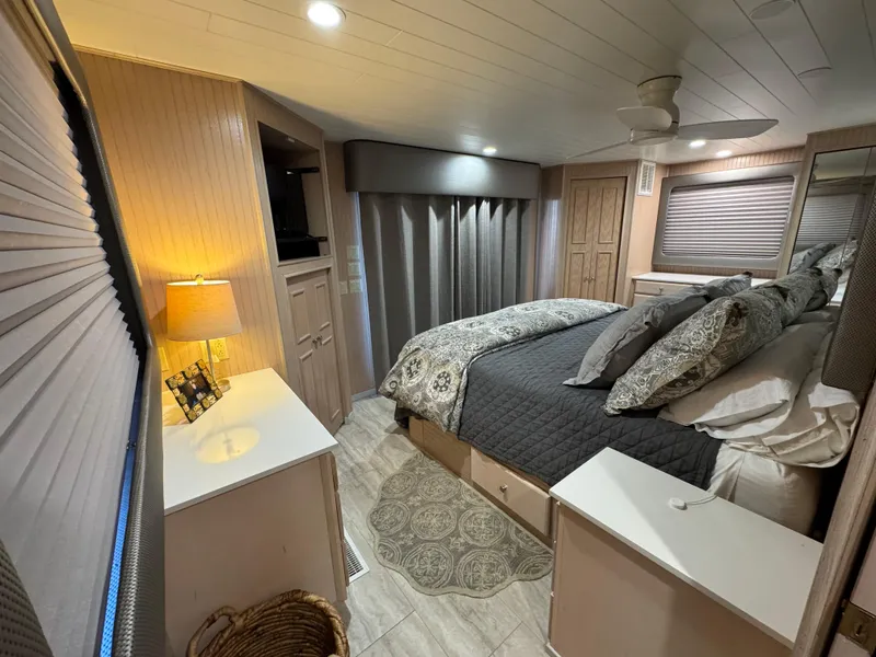 Slide: The Image of Cozy bedroom interior of 1997 Sumerset 85x18 houseboat with modern decor and soft lighting. - 26
