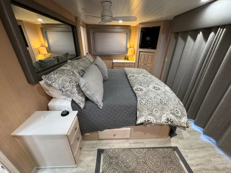 Slide: The Image of Cozy bedroom in 1997 Sumerset 85x18 houseboat with elegant decor and modern amenities. - 29