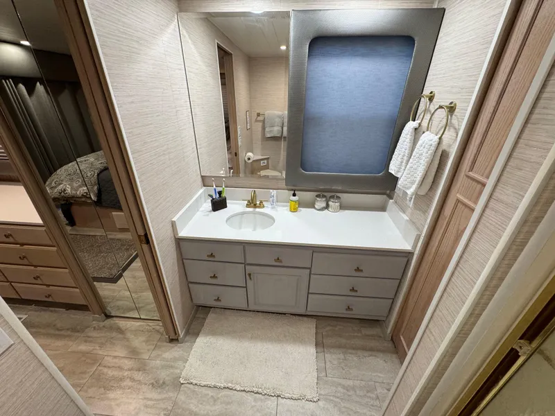 Slide: The Image of Bathroom interior of a 1997 Sumerset 85x18 houseboat with modern fixtures and ample storage. - 32