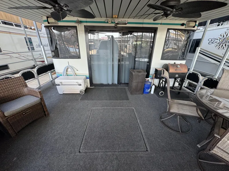 Slide: The Image of 1997 Sumerset 85x18 houseboat deck with seating, grill, and cooler. - 4