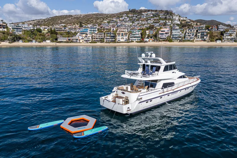 Slide: The Image of Johnson Pilothouse 70 Motor Yacht 2002 on calm waters. - 25