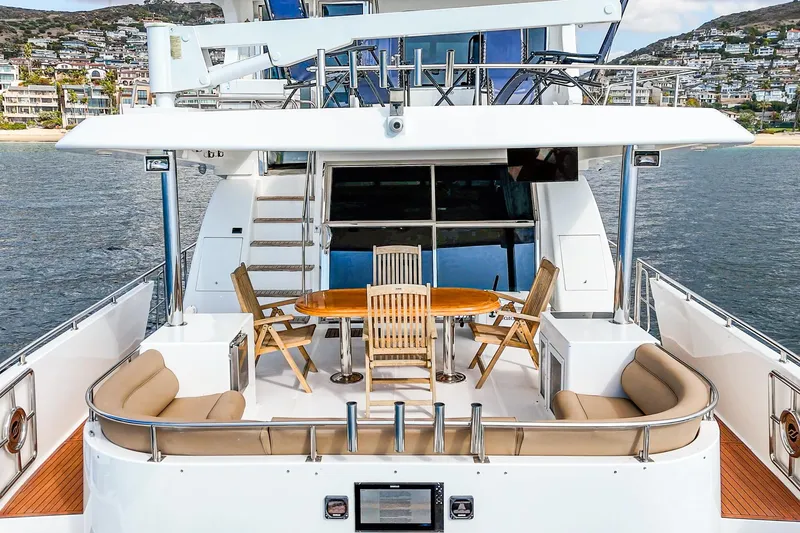 Slide: The Image of Johnson Pilothouse 70 Motor Yacht 2002, deck view with seating area. - 41