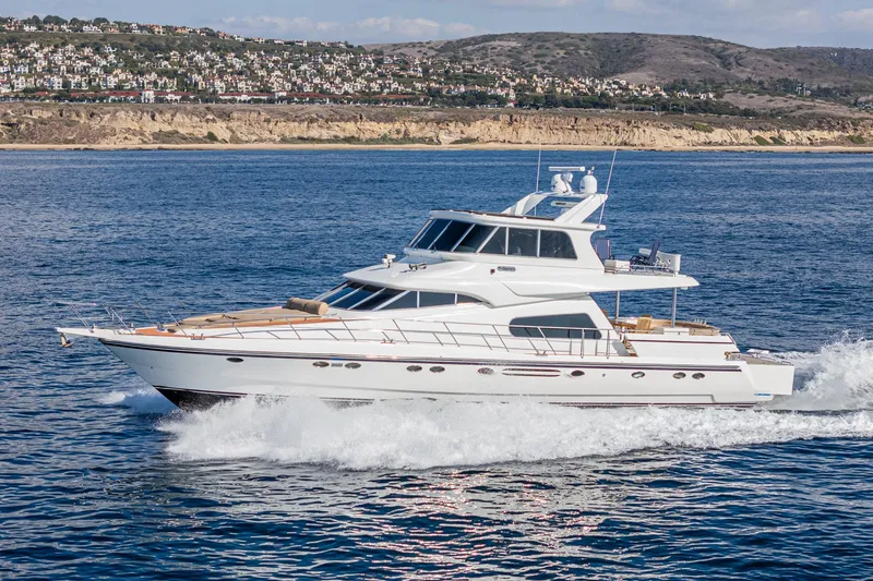 Slide: The Image of Johnson Pilothouse 70 Motor Yacht 2002 cruising on open sea. - 7