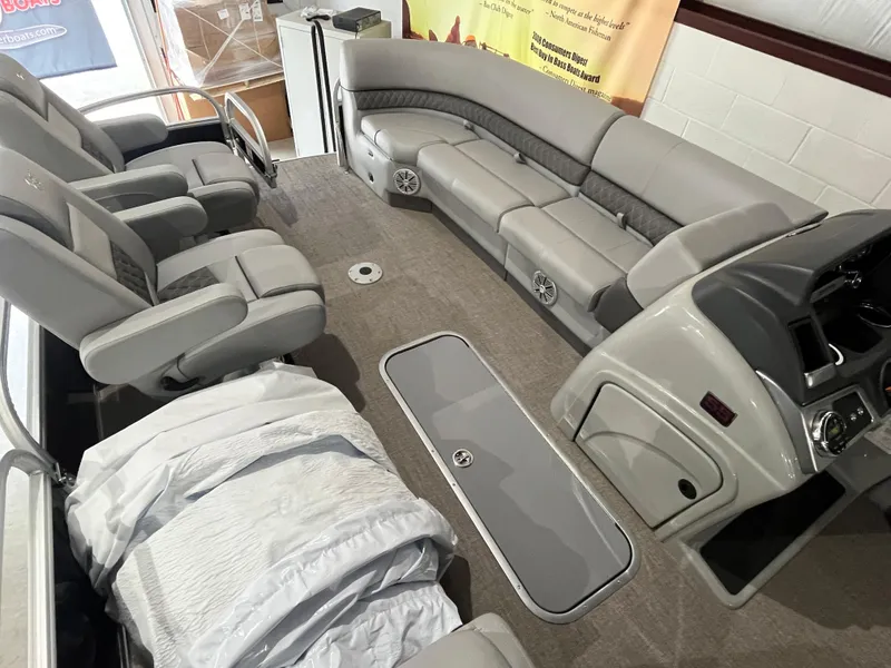 Slide: The Image of 2025 Ranger 223FC boat interior with plush seating and modern dashboard. - 3