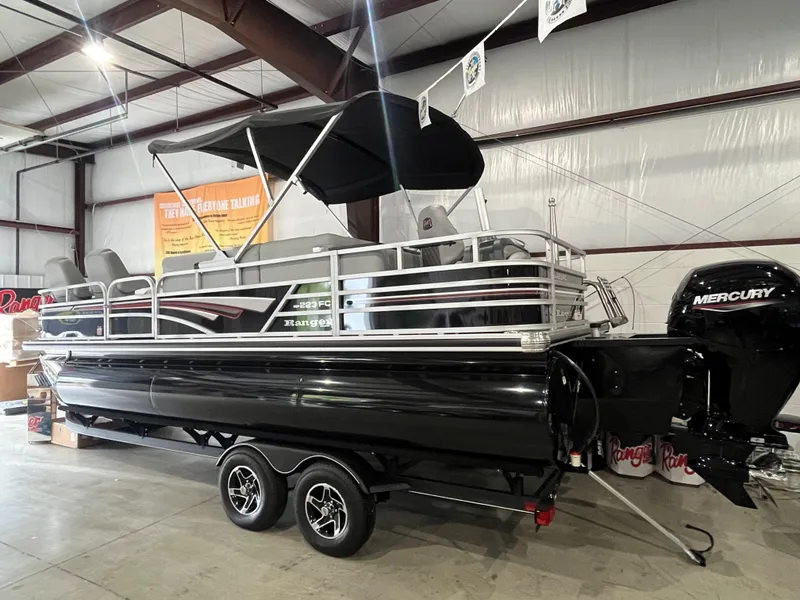 Slide: The Image of 2025 Ranger 223FC pontoon boat with Mercury engine in a showroom. - 9