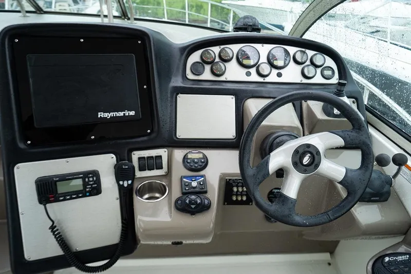 Slide: The Image of 2008 Cruisers 420 Express helm with Raymarine display and control panel. - 10