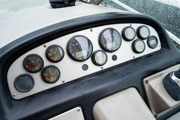 Slide: The Image of Dashboard of a 2008 Cruisers 420 Express boat with various gauges and controls. - 12
