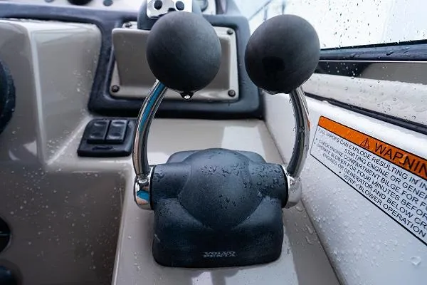 Slide: The Image of Throttle controls of a 2008 Cruisers 420 Express boat, with visible warning label. - 14