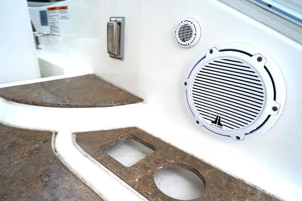 Slide: The Image of 2008 Cruisers 420 Express boat interior with built-in speakers and brown countertops. - 16