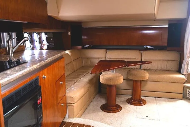 Slide: The Image of 2008 Cruisers 420 Express yacht interior with leather seating and wooden accents. - 18